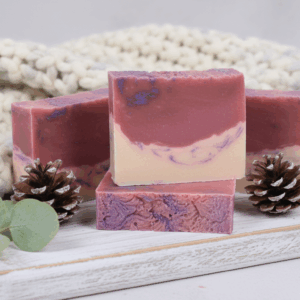 Snowdrop & thyme soap bar on a table wrapped in a blanked